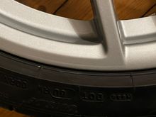 Zoom in on same long thin scratch of rear wheel