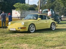 Summer Yellow at the C&C. rare color although they claim original paint my eye says a PPI is needed. Too many miles no orange peel or blemishes and painted door handles. The little things but still a rare 3.3 in a unique color. Asking $300k. 