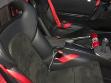 Quick (terrible quality) preview shot of the new interior.  All black alcantara!

I'll post an SLR side-by-side with the previous interior when this rain subsides.