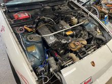 Engine bay with VW ignition coil on the front fender; still with original CIS/K-Jet