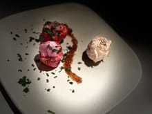 prosciutto filled strawberry topped with cilantro and dressed with marmalade..... 

