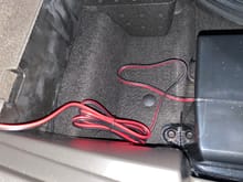 Here is where you can store the cable when not needed.  This space is under the cargo floor.  The box to the right is the Bose subwoofer in my car.