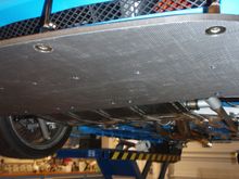 Up front the supports use the large washers you'll see on the plywood panel in the passenger footwell in a stock car:  I had a few of those in a bin.