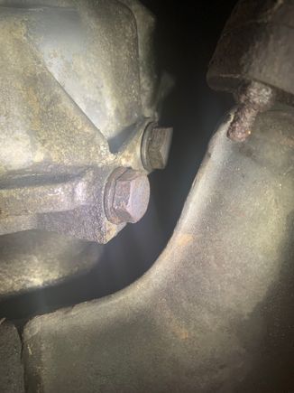 This is a bit of caked on oil on the bell housing. It is caked on where the two bolts are 