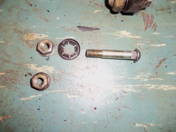 Lock nuts, push on retainer for one of the long spacers, and the d*amnable spinning stud.