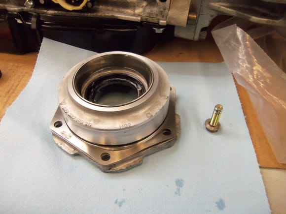 Driver's side plate lubricated and ready to install, with one mounting bolt to hold it.