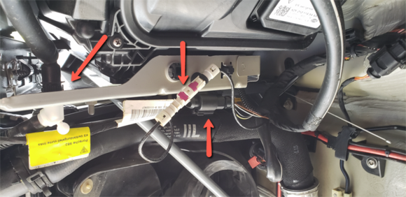 Washer hose details and electrical connections on drivers side, passenger side has 2 more electrical connections