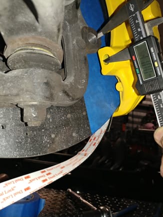 See how the axial mounting post of this front caliper goes down too far to the radial mounting hole in the wheel carrier