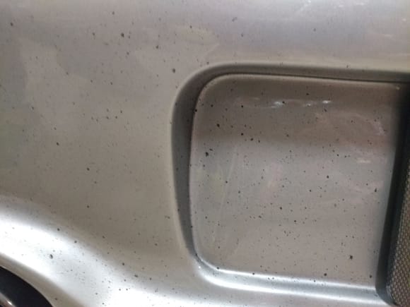 These black spots on the rear bumper was the cause for the start of the investigation - this is evidence of the car being over rich (likely caused by the vacuum leak located behind the alternator)