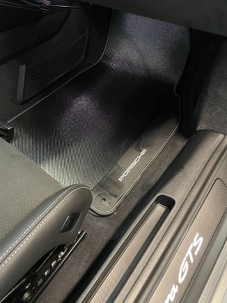 Overpriced, totally unnecessary carbon fiber mats if anybody was wondering what they look like
