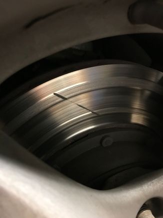 The pads were so worn that the pins attaching the pad compound to the backing plate were causing uneven pad wear (Street pads...)