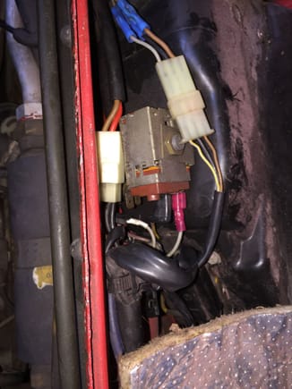 The red female spade connector goes to the fuse I wired in. The fuse holder is buried under the wiring.