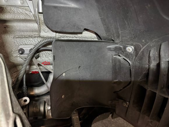 Stock GT4 air guide showing metal bracket.