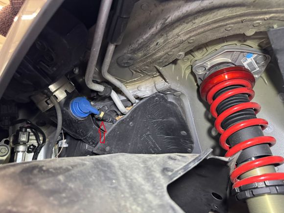 Unplug narrow line behind rear portion of front passenger side wheel well liner.