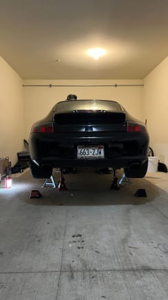 Nothing removed yet, but up on jack stands. Sorry about the quality of pictures, the lighting in the garage is not great. 