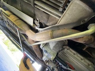 Removed the (2) 8mm screws on the small heat shields. Passenger side