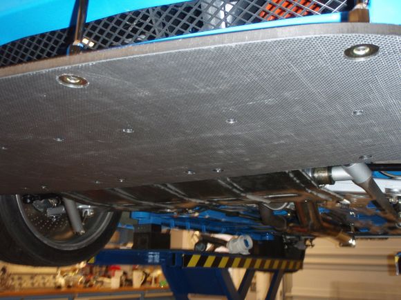 Up front the supports use the large washers you'll see on the plywood panel in the passenger footwell in a stock car:  I had a few of those in a bin.