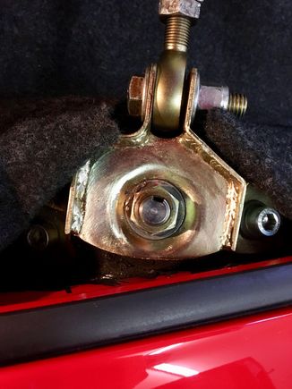 Attachment to top strut tower.