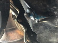 I bought a 2005 mustang 2 months ago and i was gonna give it a oil change but saw the blue stuff on the oil drain plug. What is it? Will it be save to take off the the drain plug and putting it back on .