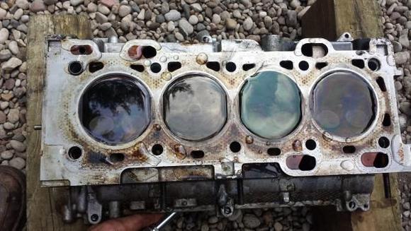 Water / bubble test for bent valves.