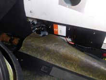 Front of the trunk, left side with the top of the rear sub frame mount exposed.