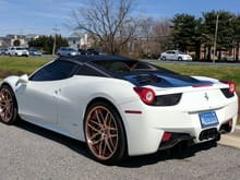 White and black Ferrari 458 Italia Spider with gold rims. This was spotted somewhere in Maryland by DeMerris Knowles. Any thoughts on this?