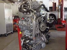 This is a picture of my engine out. They went through and cleaned everything. Turbos and headers look nice and shiny. 