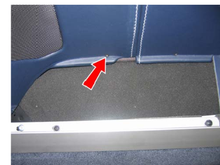 Here is a picture taken from the Vantage shop manual. This is only for the convertible cars but I can tell you that those screws you see in the picture do not exist on my car (and also have the pretty blue interior). No scres and no holes. I had a fun job getting the panel off.  The next mystery I had was the removal of the speaker grill. In the manual it says,
"see Workshop Manual procedure 1.05.CP/01.05.CN " 
I couldn't find that section and I did a search of the manual!