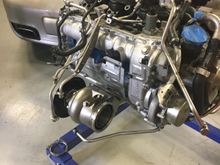 Here's a shot of the engine on the stand test fitting the turbos/headers before fabricating the mid-pipes to adapt this turbine housing to the BBi exhaust.