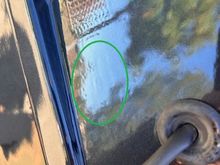 OEM part # is paint over (oval circle). Note the wavy square emboss that exist only on OEM wing.