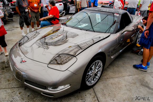 The guys from Clear Auto Bra just installed XPEL ULTIMATE on the hood of this custom painted Corvette and are now working on protecting the custom paint on the gas cap with XPEL ULTIMATE