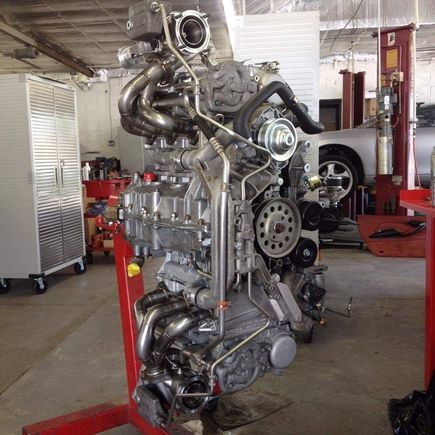 This is a picture of my engine out. They went through and cleaned everything. Turbos and headers look nice and shiny. 