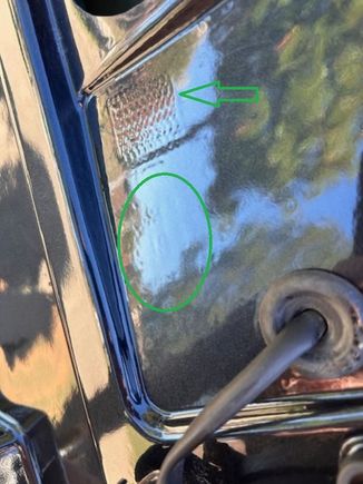 OEM part # is paint over (oval circle). Note the wavy square emboss that exist only on OEM wing.