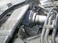 After experimenting, this is the best intake setup I've used to date.  A Spectre filter with a modified factory air duct(I sliced the bottom off almost to the ridges in the plastic) run right over the top of the filter, as close to the front grill as possible... cost about 50$ total