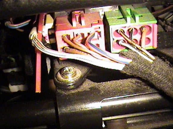 This is the view under the driver's seat.  The airbag connector is the one on the left (yellow).  Zip tie it carefully and turn off your airbag light.