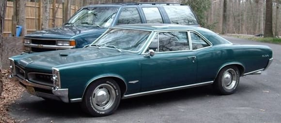 66 GTO, all stock except the wheels.  Resurrected from having sat in somebody's garage with a seized engine for years.