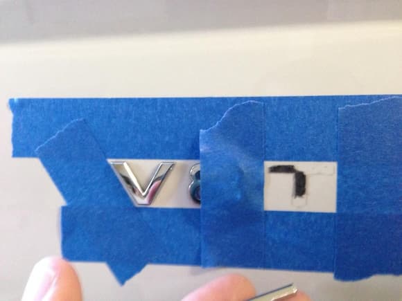 Used blue tape as a guide to remember the correct positioning of the emblems.