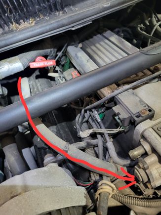 I think the hose as it disappears goes to the air intake. Different to track since its very tight in there.