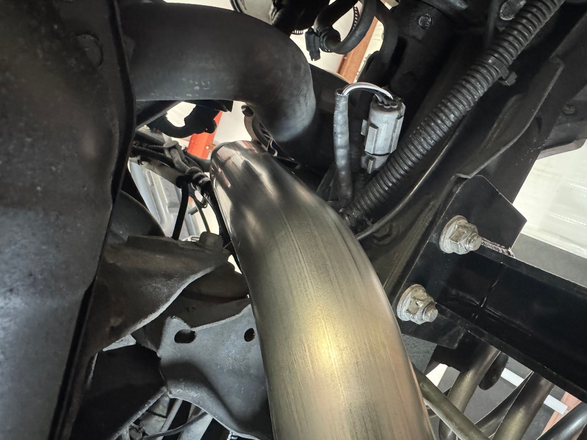 I plan to build a support bracket off the engine and wrap the exhaust for safety and heat retention. 