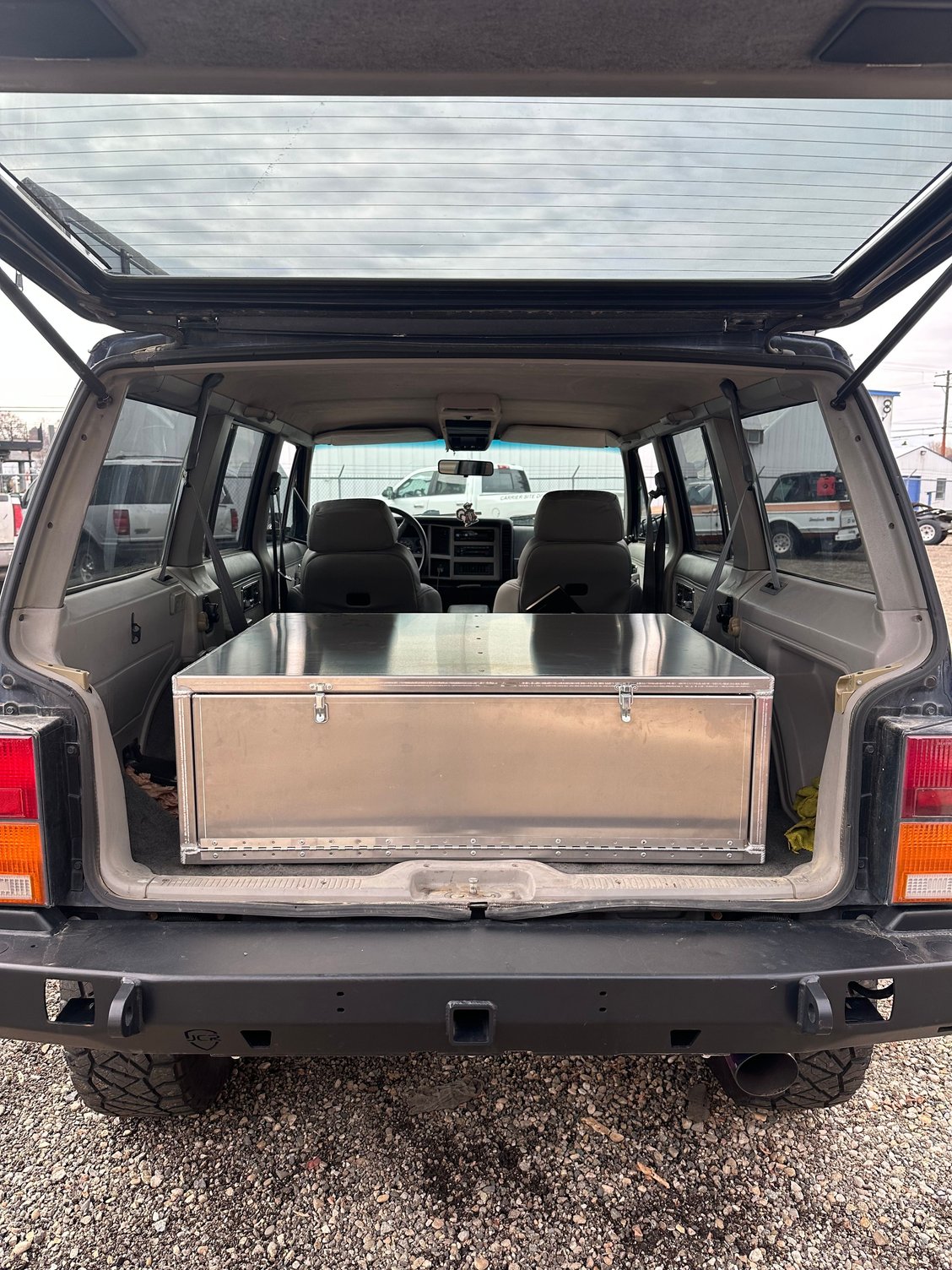 Had a buddy build up a aluminum drawer for the rear of the jeep.