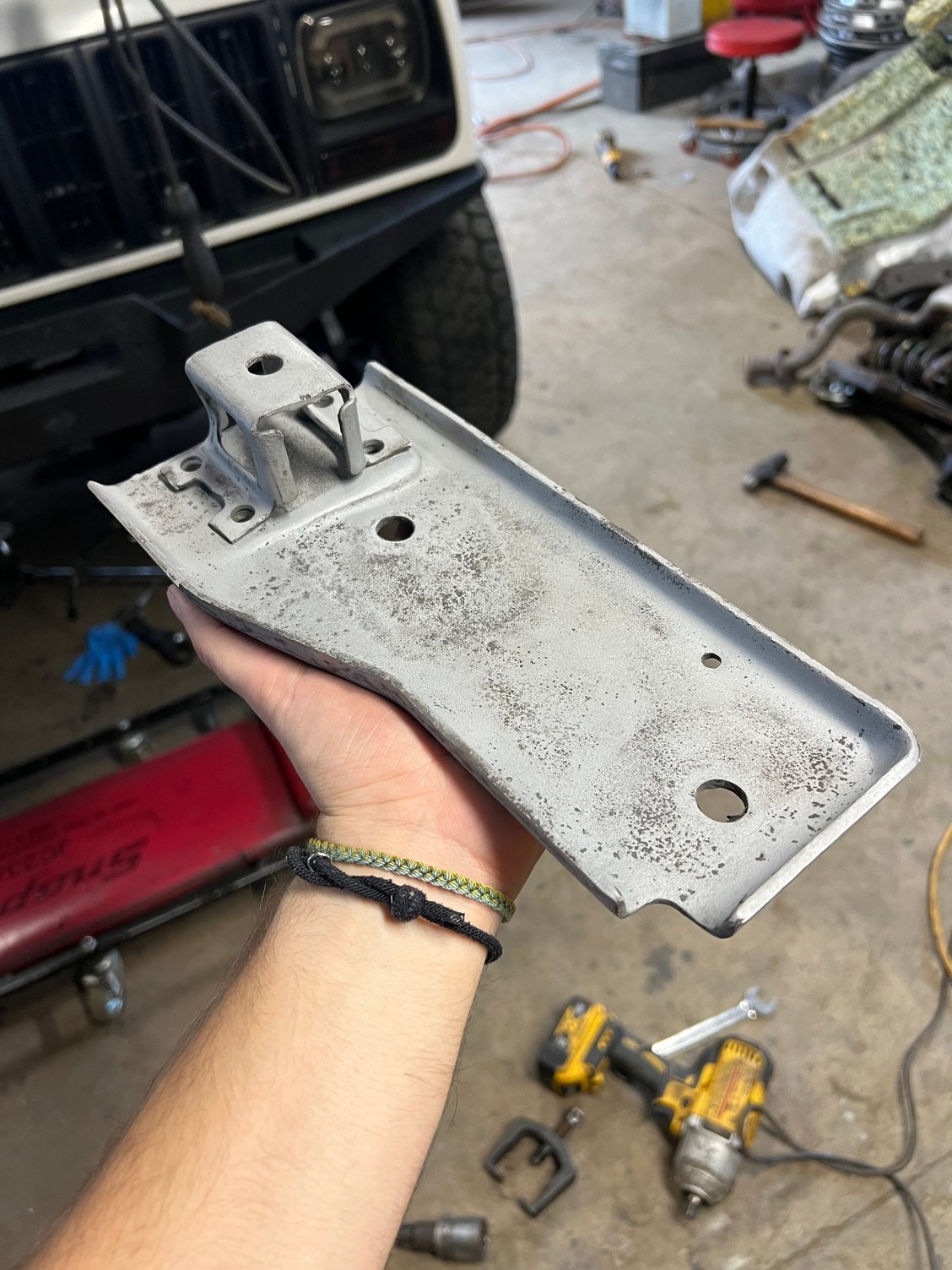 Transmission mount plate and hanger bracket sandblasted 