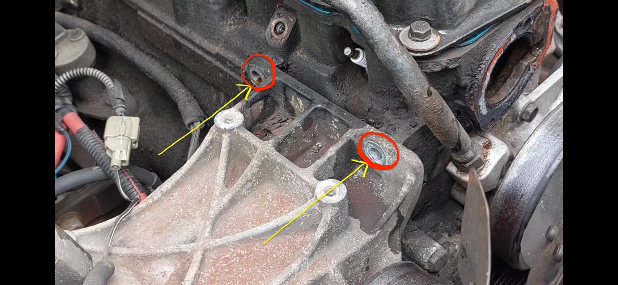 top bolts for the A/C compressor bracket that bolts into cylinderhead?