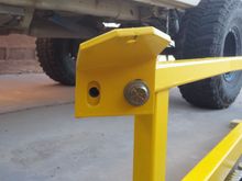 Installing the adjustable mounting tab on the front.