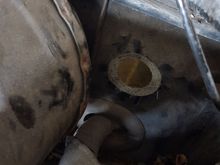 Brake booster on the left, main wiring harness below. There is a cap seali g it but pops out easily.
