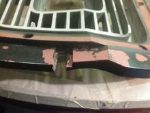 That one holds a nylon nut to secure the headlight door.