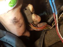 2nd round, these wires melted on driver side, near air cleaner. yellow pieces attach to vacuum lines. not sure what this whole thing is? connects to pigtail that had a red/white wire, potentially same red/white wire as from 1st melted green wire?