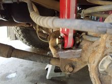 Fairly simple to do if you have a buddy that can weld.
I bought a box of like 200 of these shock tabs like 10 years ago. They have curve to fit a 1 3/4" tube. I cut them flat here.

These are hand me down shocks from my 2002 dodge 3500 stock height shocks.

You can also get a adapeter to get eye shocks instead of stud style. 