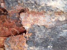 Bottom of carpet,hole is about size of grapefruit. 
I suspect there's more. I'm going pull all carpet and pray its not in bad shape. Its 1988 jeep. Also been sprayed on undercarriage with same thing on body of jeep. 