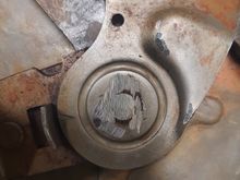 Rivet head ground down to disassemble the bracket.