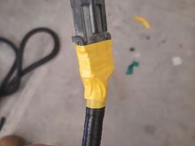 I wrapped the ends from the coorogated tubing up to the back of the connector with electrical tap to attemp to make more of a water resistant transition. I used yellow because some of the other plastics were already yellow so it seemed fitting.